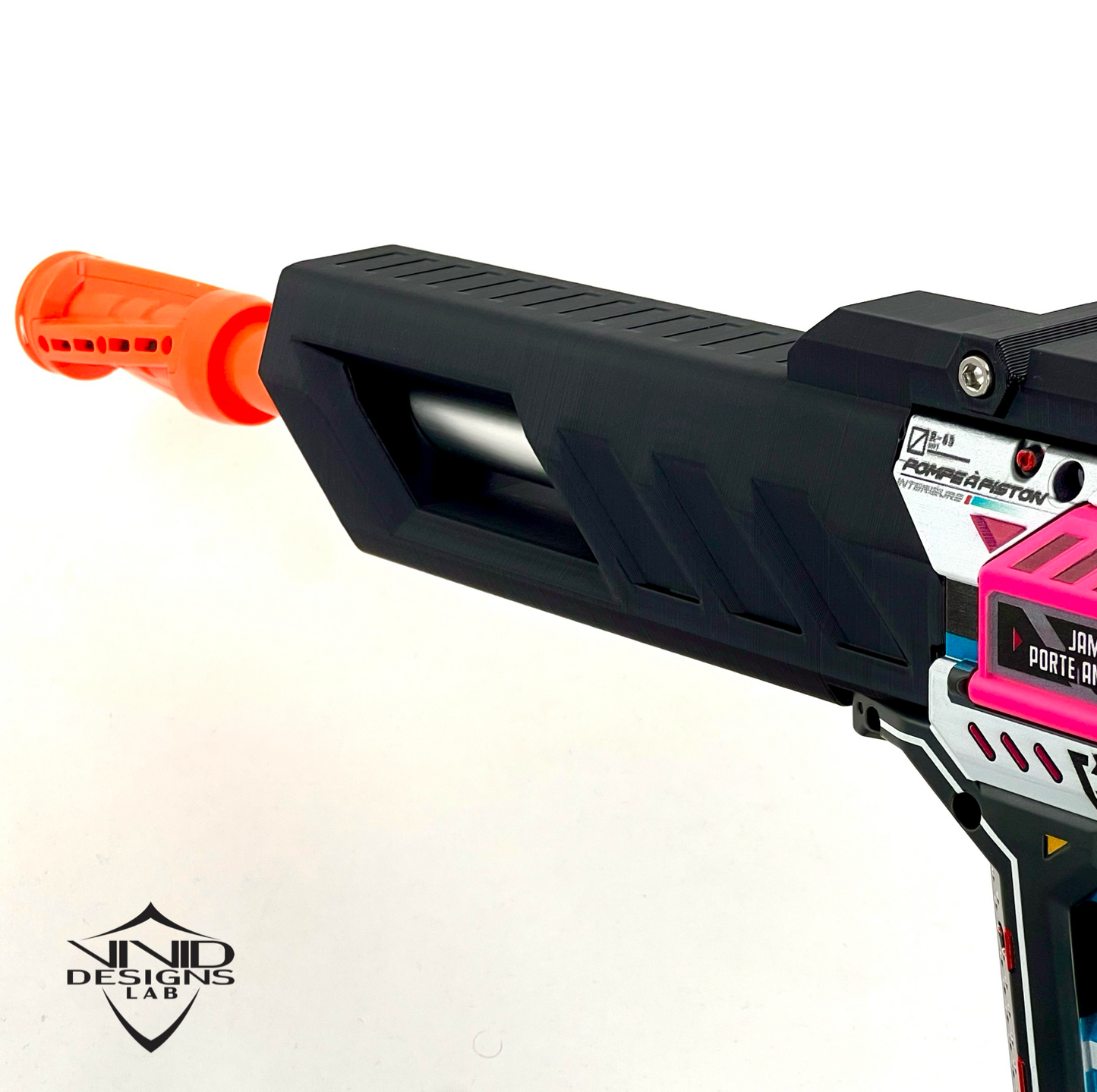 Close-up of a black and pink toy foam dart blaster with an orange tip on a white background, featuring the Vivid Designs Lab logo.