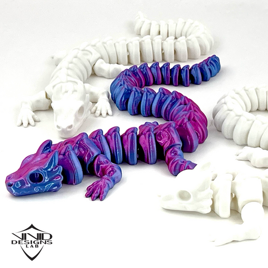 3D printed articulated toy bone dragons on white background, high quality toy