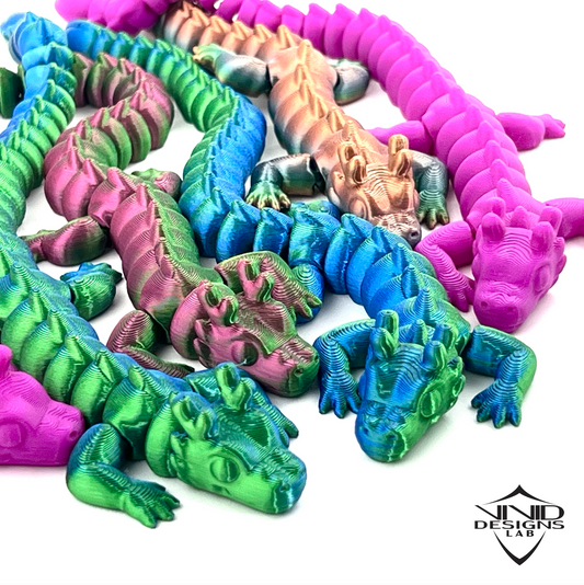 Cute and adorable 3D printed mini baby dragons with white background and Vivid Designs Lab branding, high quality toy